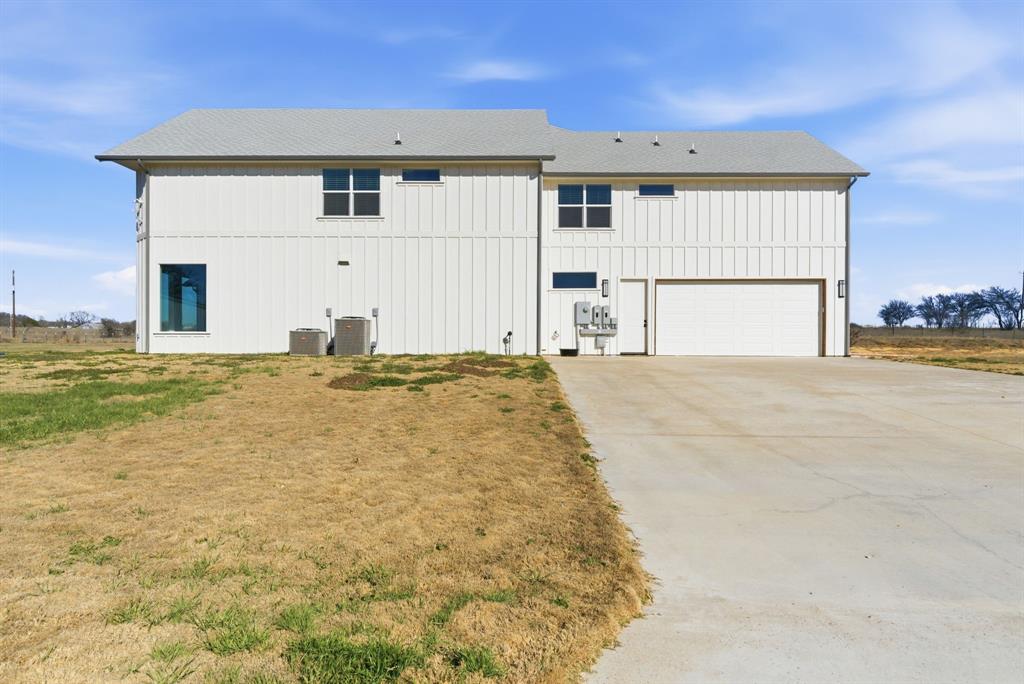 4600 Old Brock Road Weatherford, TX 76087 - Photo 37 of 40 View of property exterior featuring an attached garage and driveway