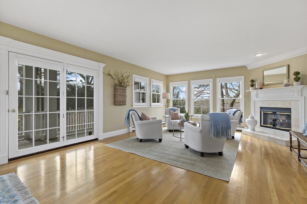 105 Parker Road, Unit A Barnstable, MA 02655 - Photo 1 of 37 a living room with furniture and a fireplace