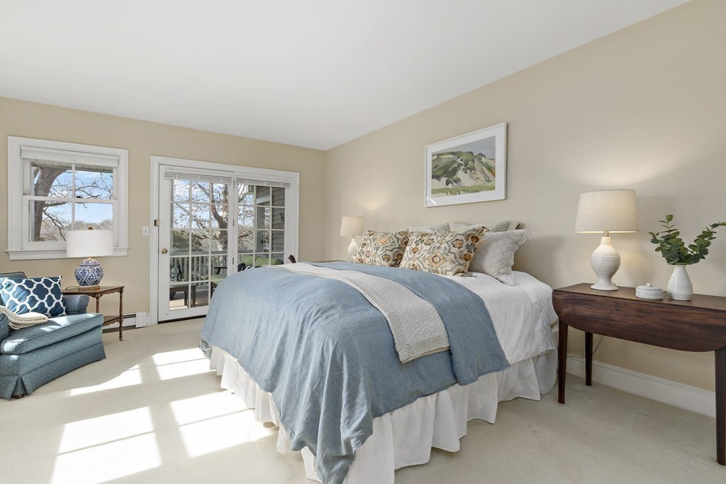 105 Parker Road, Unit A Barnstable, MA 02655 - Photo 11 of 37 a bedroom with a bed mirror and window