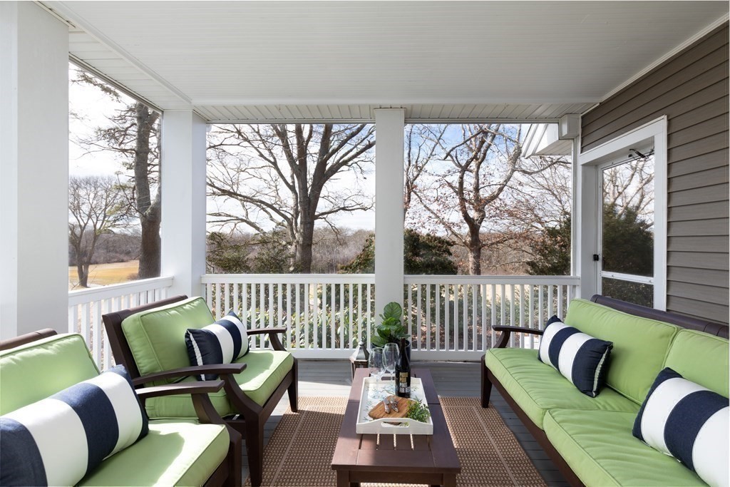 105 Parker Road, Unit A Barnstable, MA 02655 - Photo 13 of 37 a living room with furniture and a large window