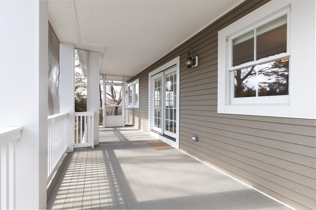 105 Parker Road, Unit A Barnstable, MA 02655 - Photo 19 of 37 a view of a balcony with wooden floor
