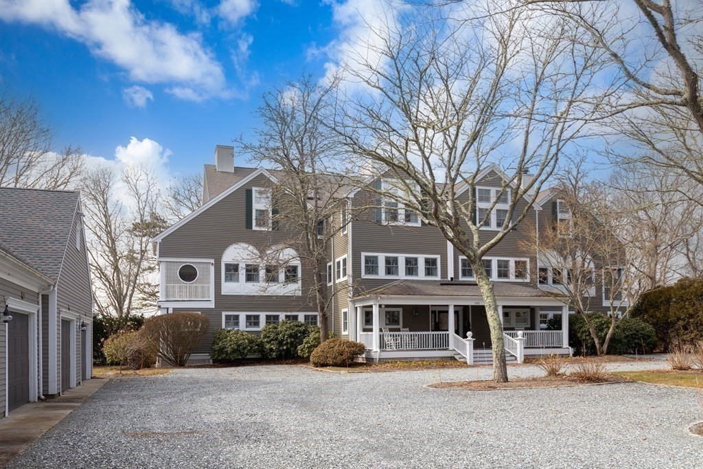 105 Parker Road, Unit A Barnstable, MA 02655 - Photo 3 of 37 a front view of a building with a garden