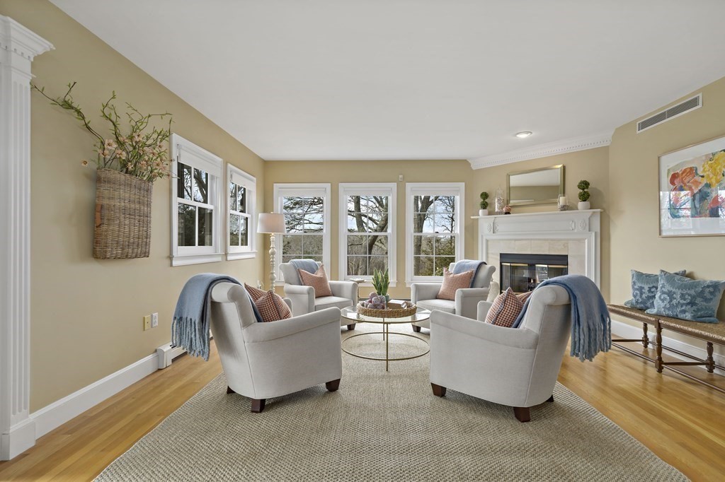 105 Parker Road, Unit A Barnstable, MA 02655 - Photo 4 of 37 a living room with furniture and a fireplace