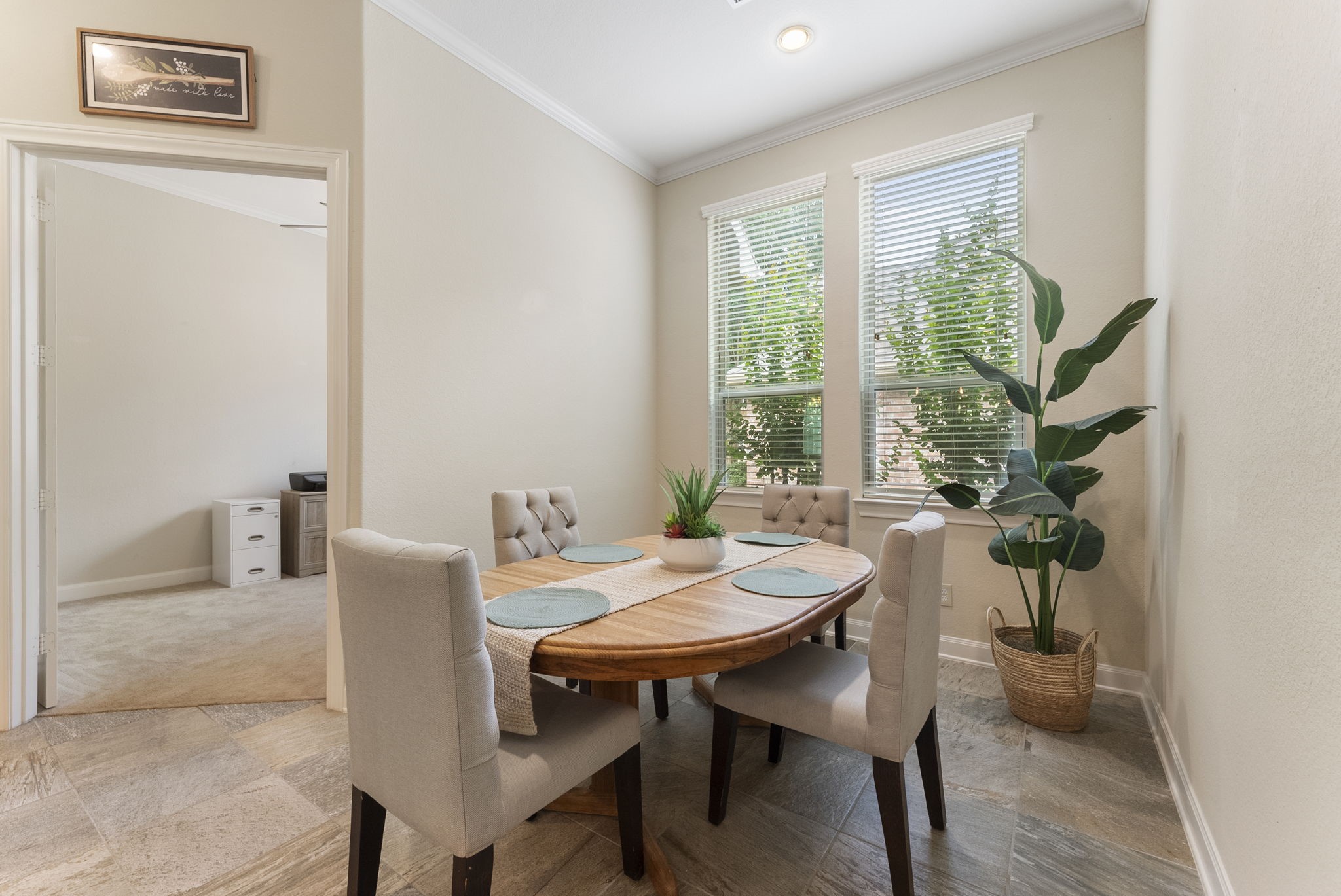 4787 Jackson Square Drive Conroe, TX 77304 - Photo 15 of 35 A charming breakfast room—a cozy haven bathed in soft morning light, perfect for starting your day on the right note. Whether you're savoring your first cup of coffee or diving into a stack of pancakes, this space invites you to linger and connect. The inviting atmosphere makes it easy to share stories, plan your day, or simply enjoy the quiet hum of a new morning. It's more than just a place to eat; it's a setting where memories are made and conversations flow.