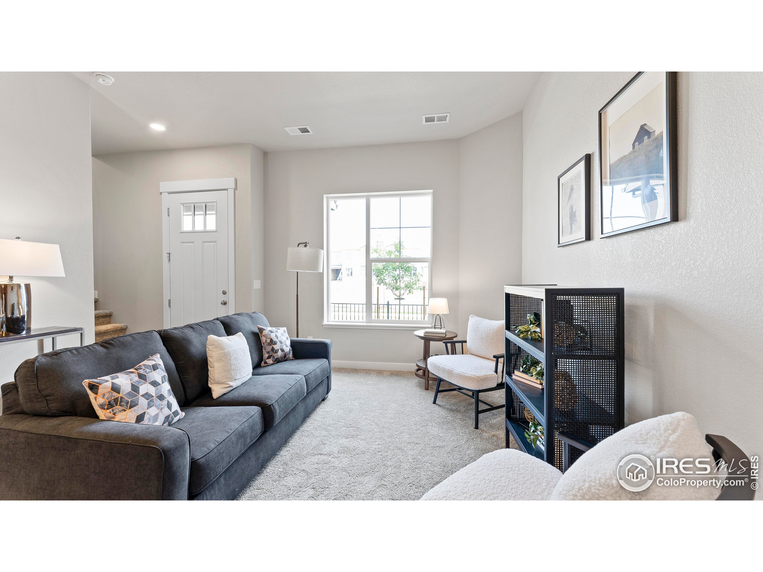 6780 Maple Leaf Drive Timnath, CO 80547 - Photo 11 of 26 a living room with furniture and a window