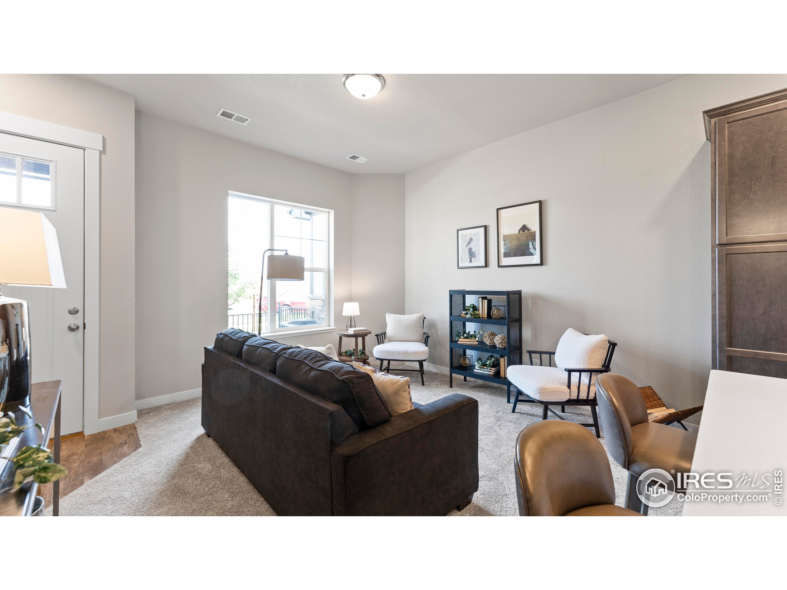 6780 Maple Leaf Drive Timnath, CO 80547 - Photo 12 of 26 a living room with furniture and a window