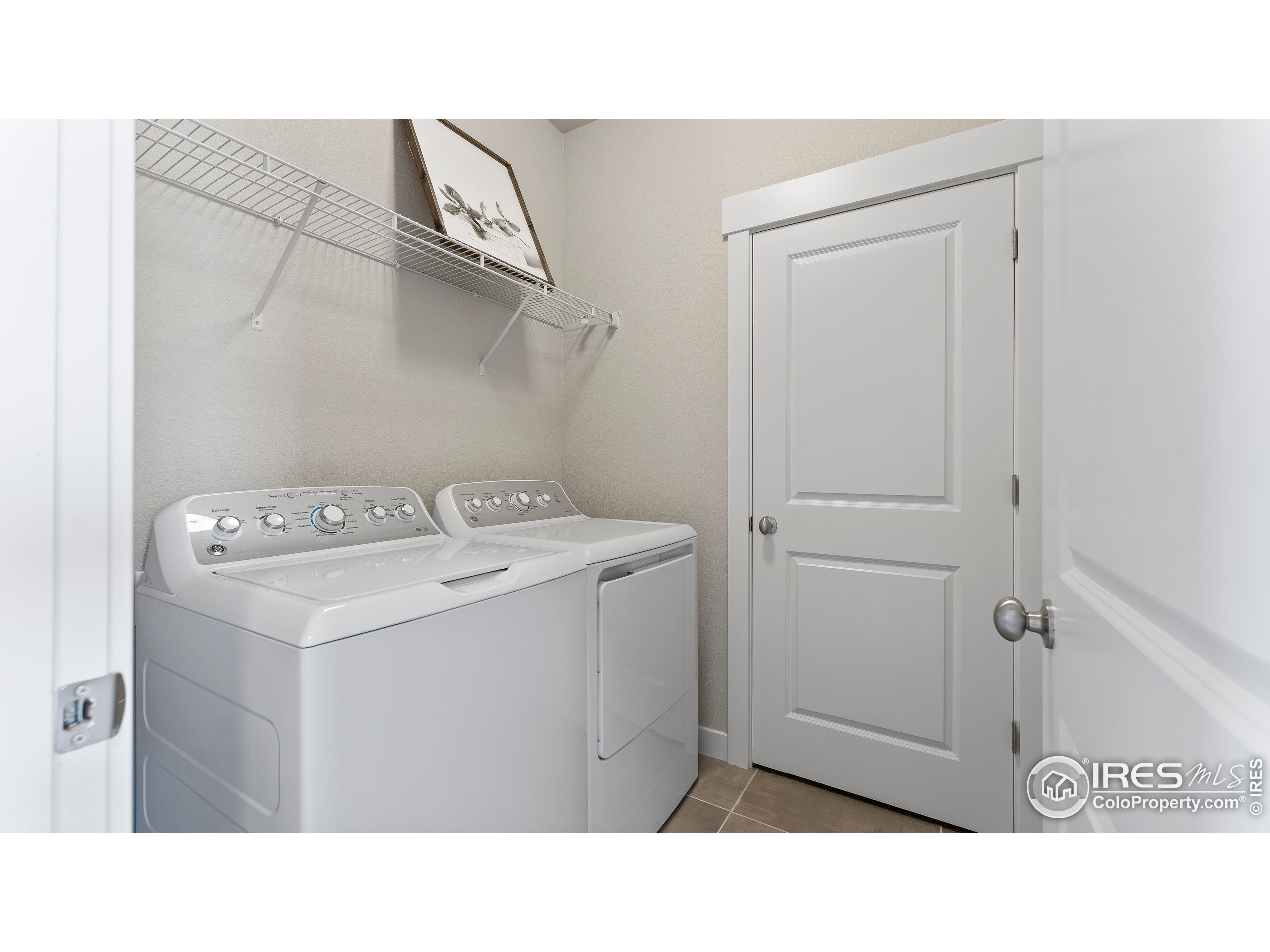6780 Maple Leaf Drive Timnath, CO 80547 - Photo 14 of 26 a utility room with dryer and washer