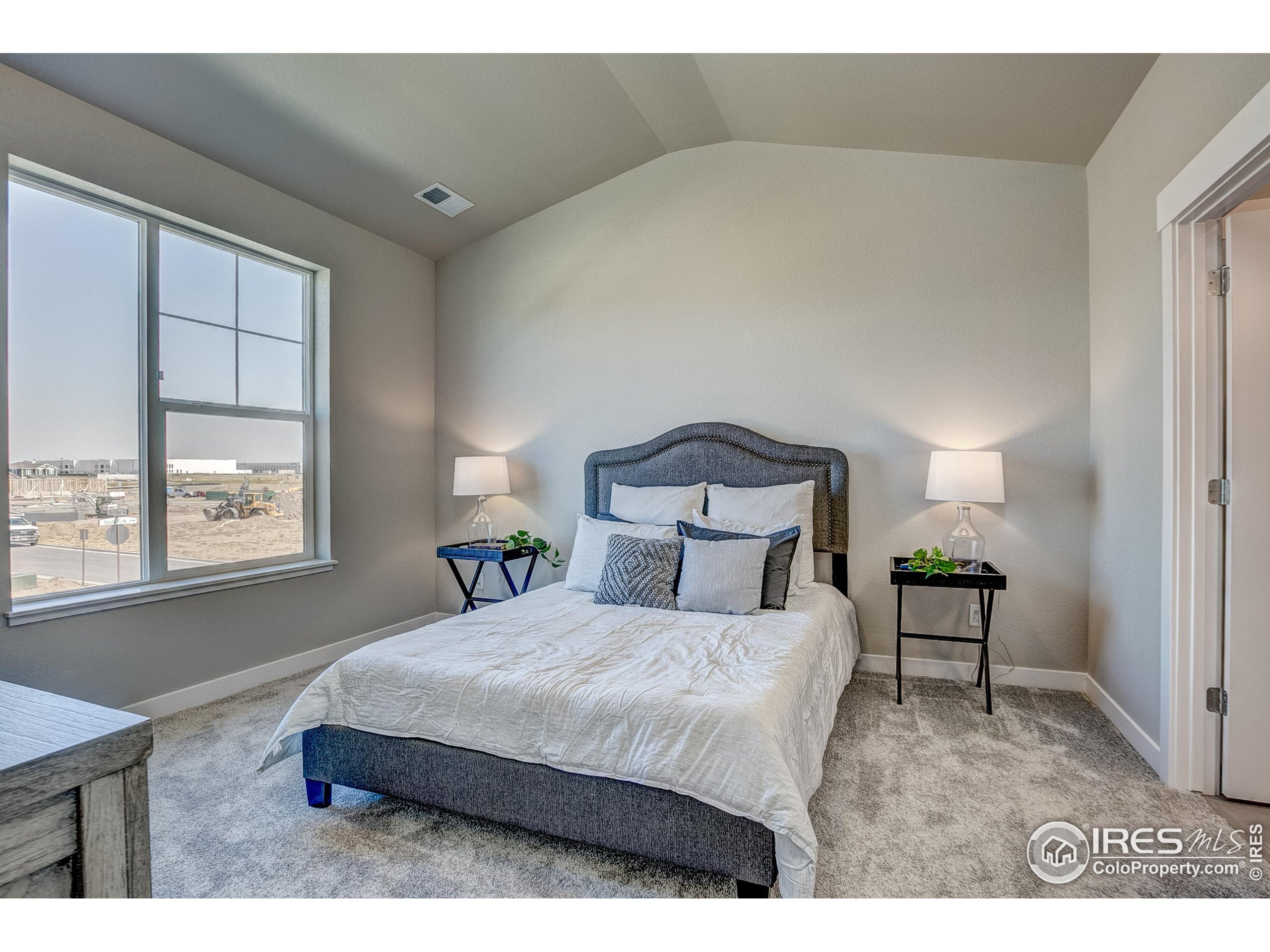 6780 Maple Leaf Drive Timnath, CO 80547 - Photo 16 of 26 a bedroom with a bed and window