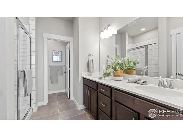 a bathroom with a sink double vanity and a mirror
