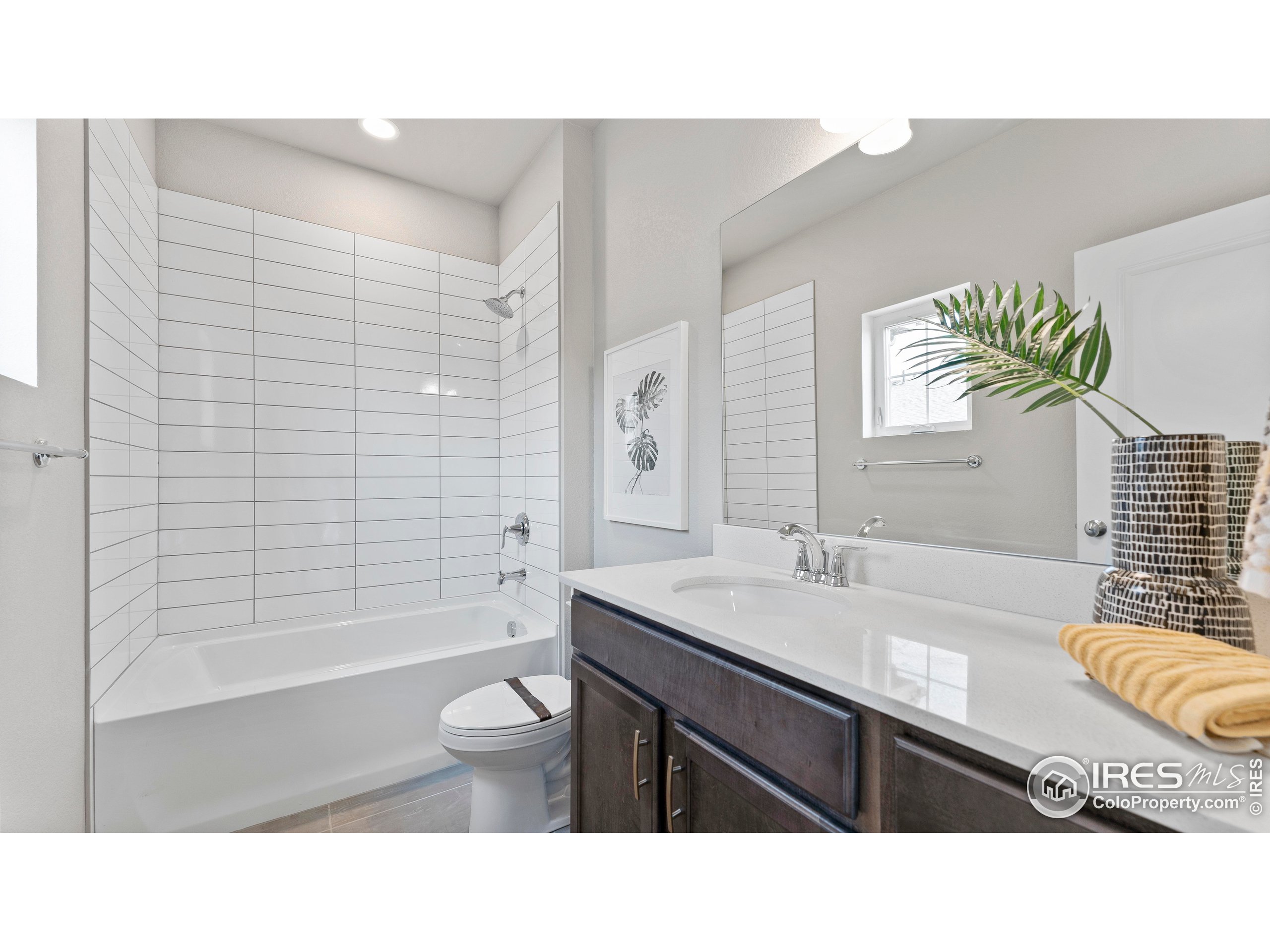 6780 Maple Leaf Drive Timnath, CO 80547 - Photo 23 of 26 a bathroom with a sink a toilet and shower