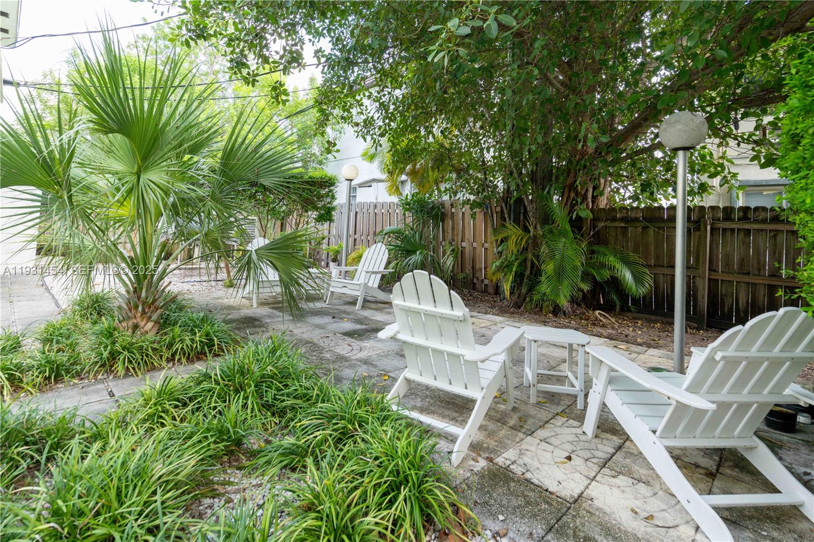 1007 Bay Drive, Unit 205 Miami Beach, FL 33141 - Photo 16 of 17 a view of yard with seating area and green space