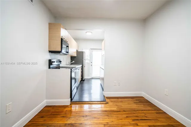 a view of a kitchen with a sink and dishwasher