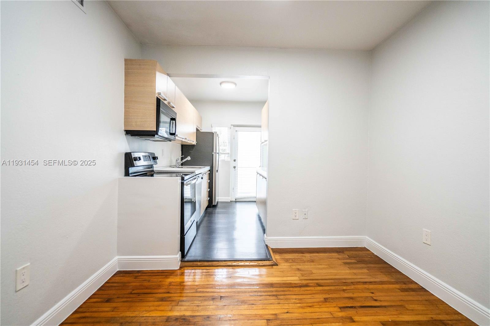 1007 Bay Drive, Unit 205 Miami Beach, FL 33141 - Photo 6 of 17 a view of a kitchen with a sink and dishwasher