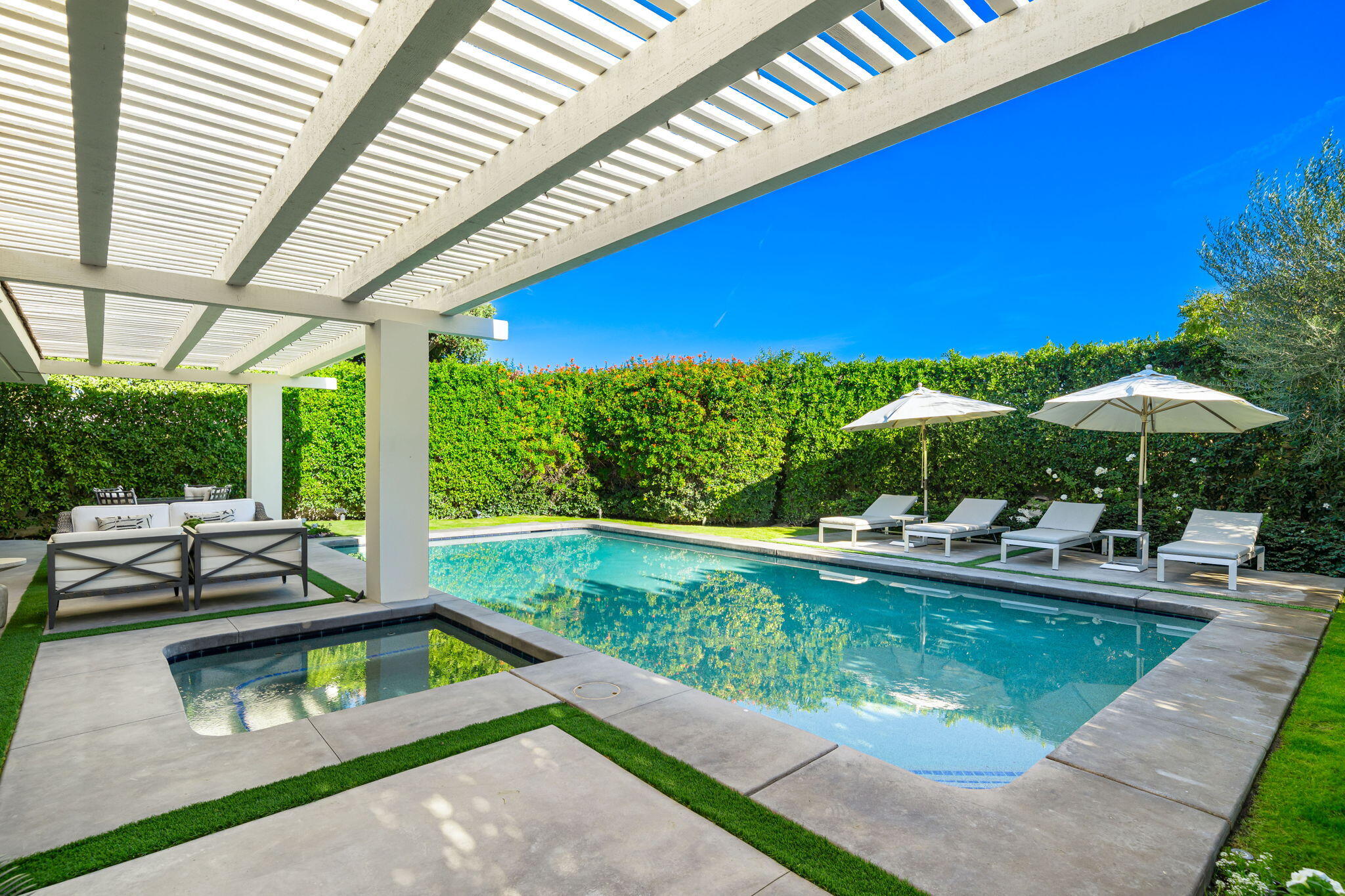 6 Exeter Court Rancho Mirage, CA 92270 - Photo 27 of 54 a view of a swimming pool with a patio