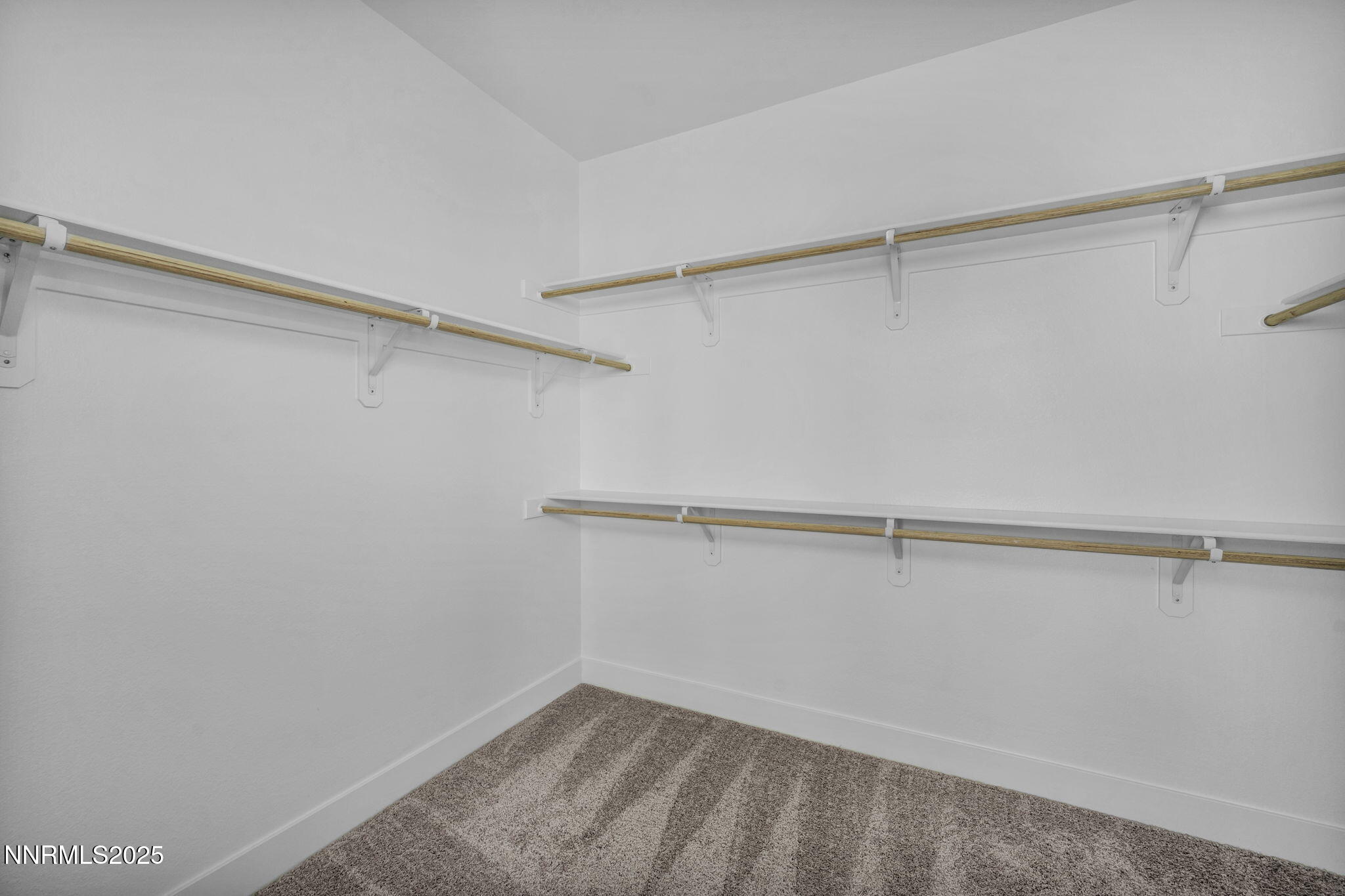 1328 Nebula Road, Unit HOMESITE 93 Carson City, NV 89705 - Photo 5 of 12 a view of a room with racks on the wall