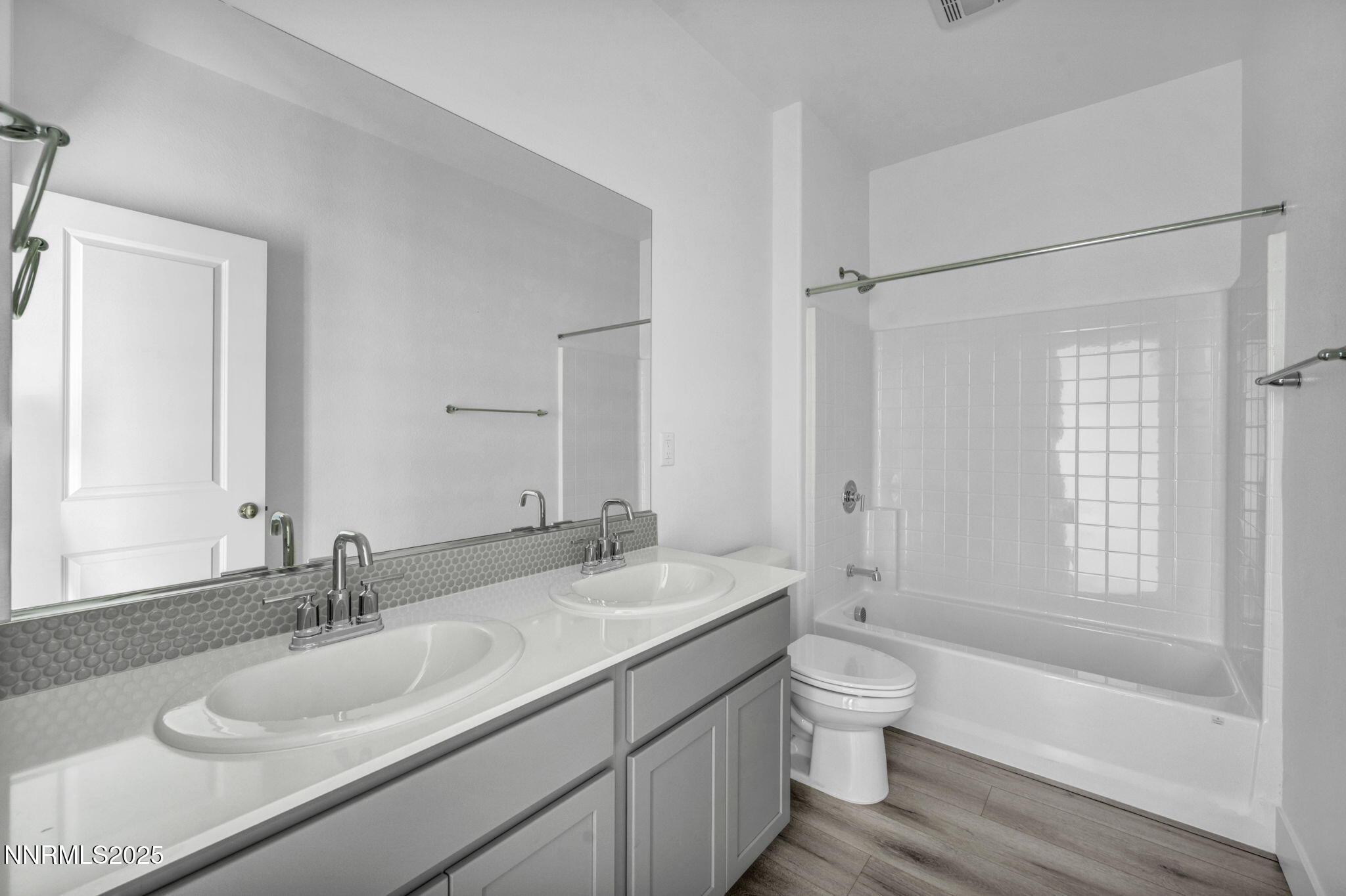 1328 Nebula Road, Unit HOMESITE 93 Carson City, NV 89705 - Photo 7 of 12 a bathroom with a granite countertop sink toilet a large mirror and shower