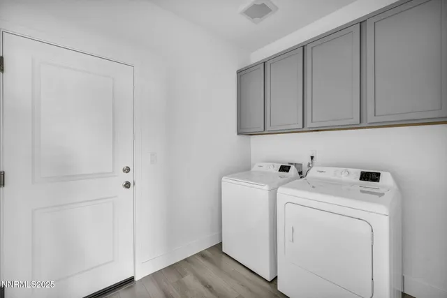 a view of storage and utility room with washer and dryer