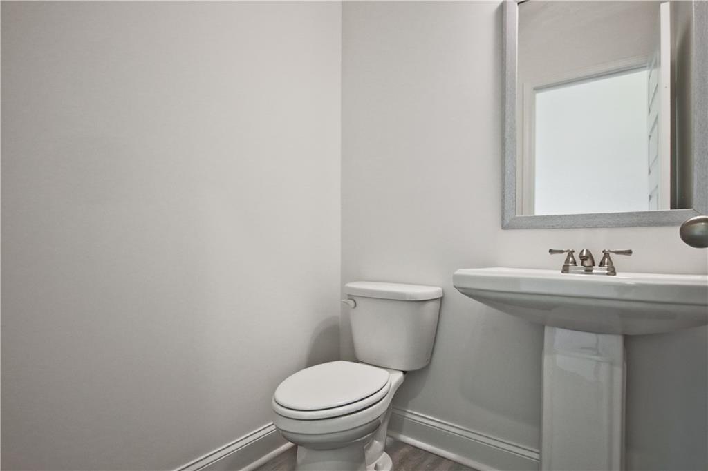 5985 Spring Way Lithonia, GA 30058 - Photo 16 of 34 a bathroom with a sink toilet and a mirror