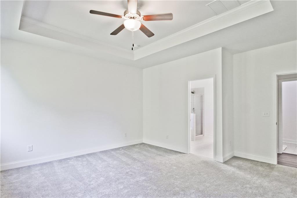 5985 Spring Way Lithonia, GA 30058 - Photo 19 of 34 an empty room with chandelier fan