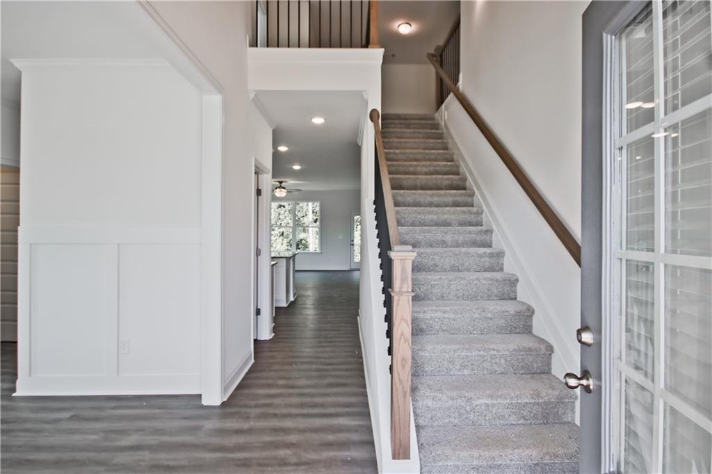 5985 Spring Way Lithonia, GA 30058 - Photo 2 of 34 a view of a hallway with wooden floor and entryway