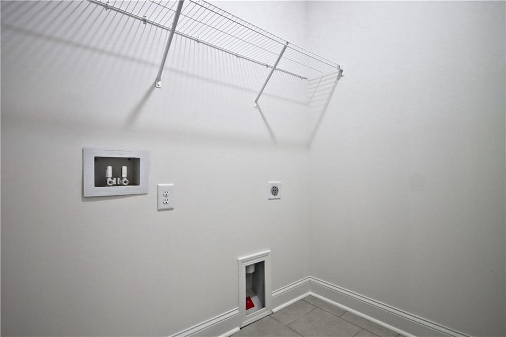 5985 Spring Way Lithonia, GA 30058 - Photo 26 of 34 a view of storage and utility room with wooden floor