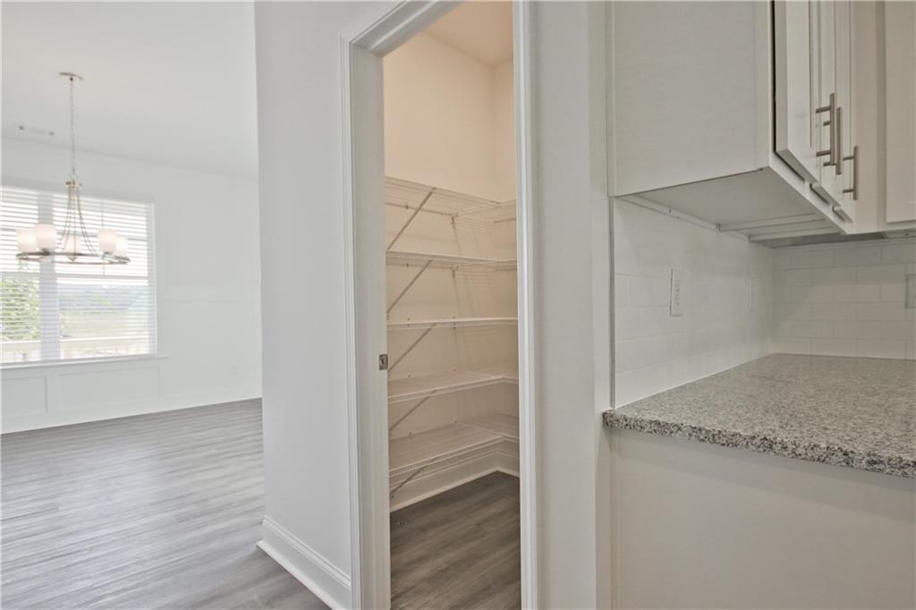 5985 Spring Way Lithonia, GA 30058 - Photo 27 of 34 a room with wooden floor and a window