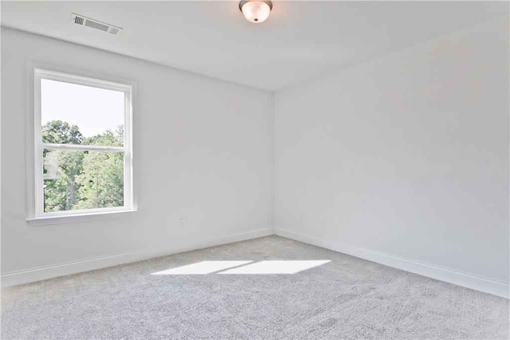 5985 Spring Way Lithonia, GA 30058 - Photo 31 of 34 an empty room with a window