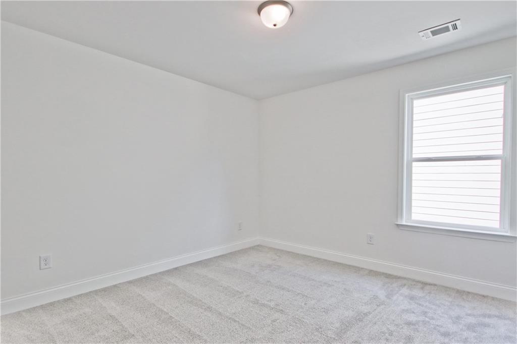 5985 Spring Way Lithonia, GA 30058 - Photo 32 of 34 an empty room with a window