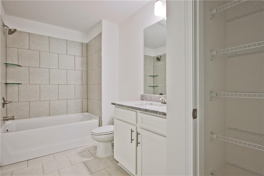 5985 Spring Way Lithonia, GA 30058 - Photo 34 of 34 a bathroom with a bathtub toilet and sink