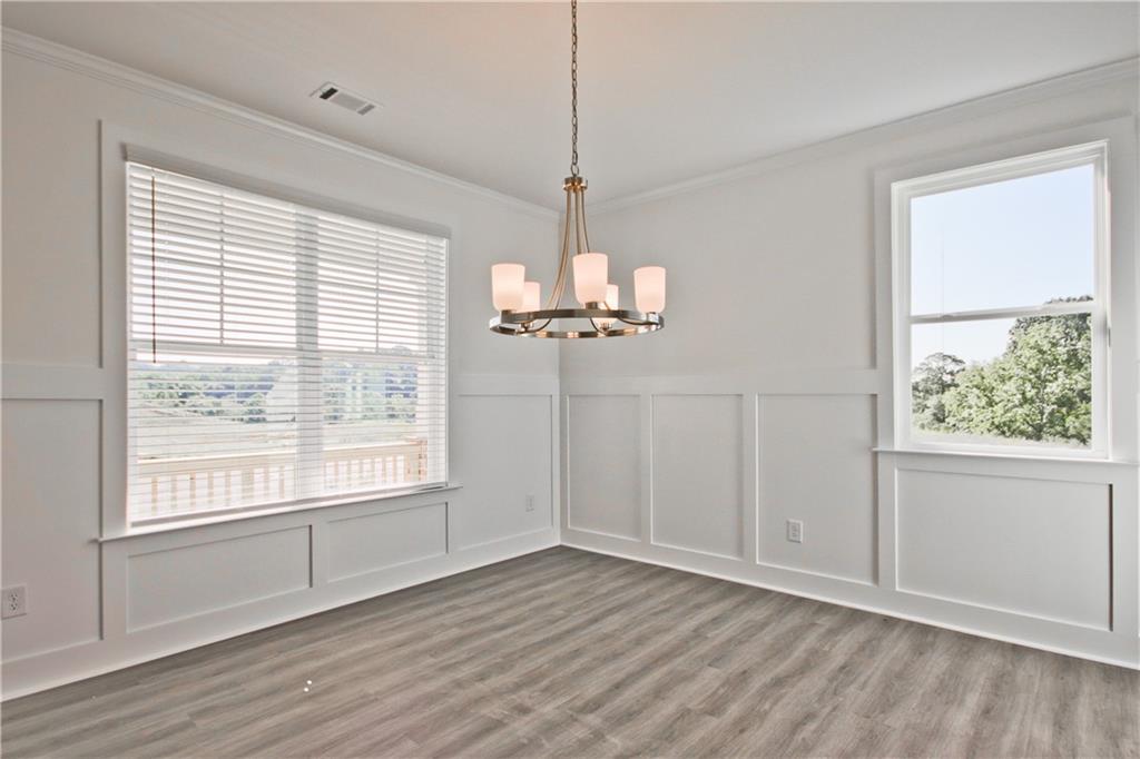 5985 Spring Way Lithonia, GA 30058 - Photo 5 of 34 a view of a room with wooden floor and a window