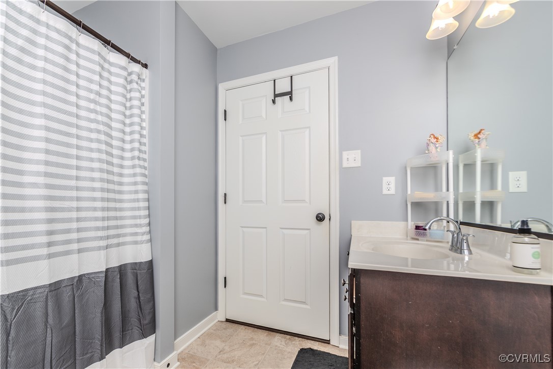 1990 Walnut Tree Road Powhatan, VA 23139 - Photo 20 of 40 a bathroom with a double vanity sink and a mirror