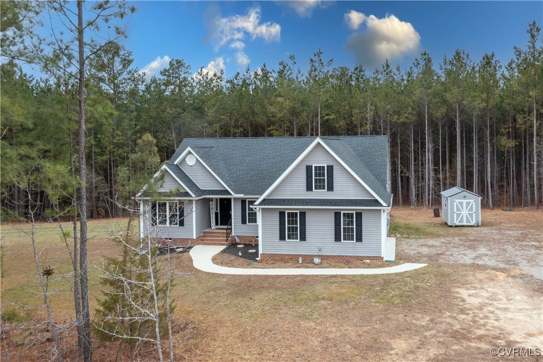 1990 Walnut Tree Road Powhatan, VA 23139 - Photo 4 of 40 a front view of a house with garden