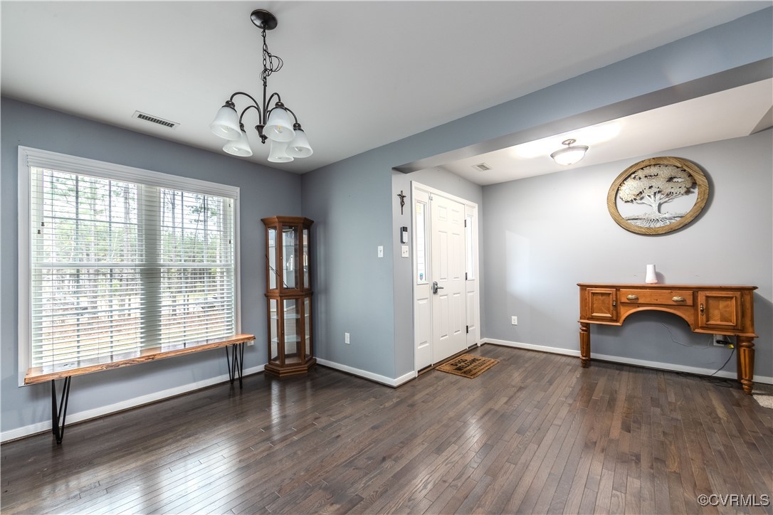 1990 Walnut Tree Road Powhatan, VA 23139 - Photo 7 of 40 a view of an empty room with a window and wooden floor