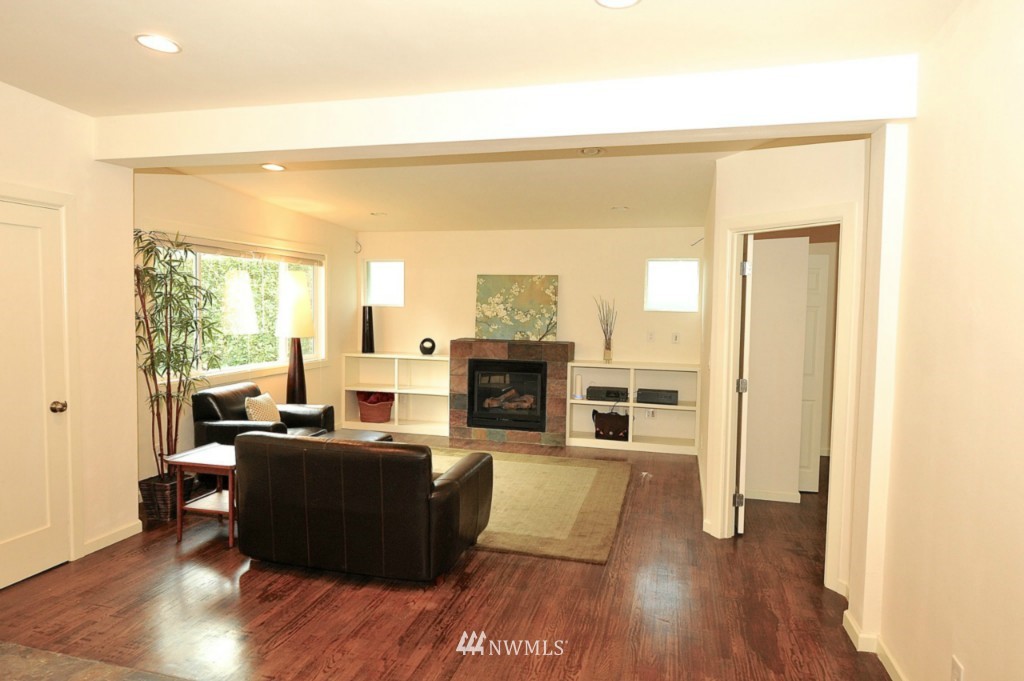 14205 Southeast Allen Rd. Bellevue, WA 98006 - Photo 3 of 15 a living room with furniture and a fireplace