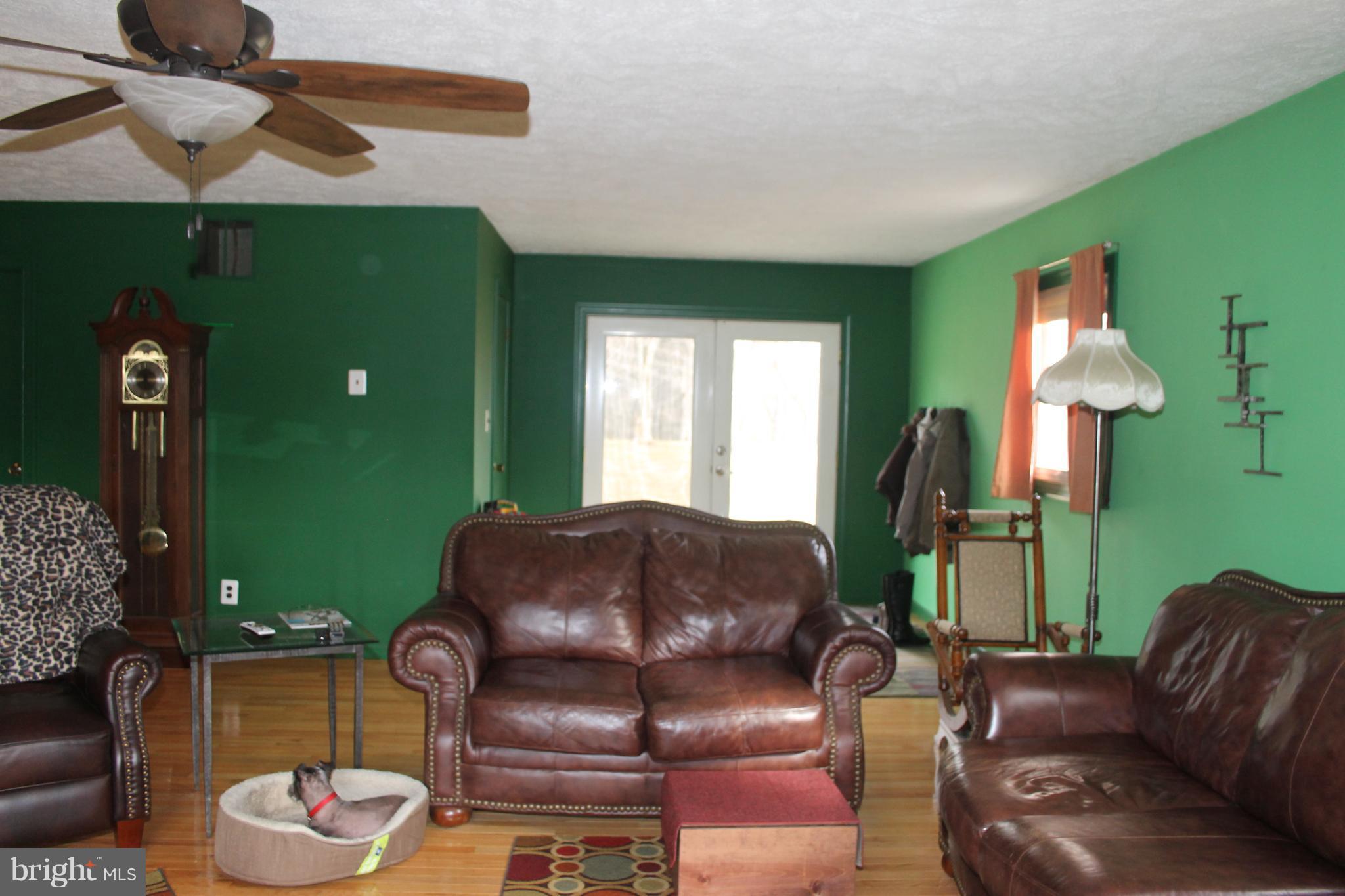 64 Castle Mountain Road Castleton, VA 22716 - Photo 16 of 29 Family Room with 1/2 bath and opens to patio