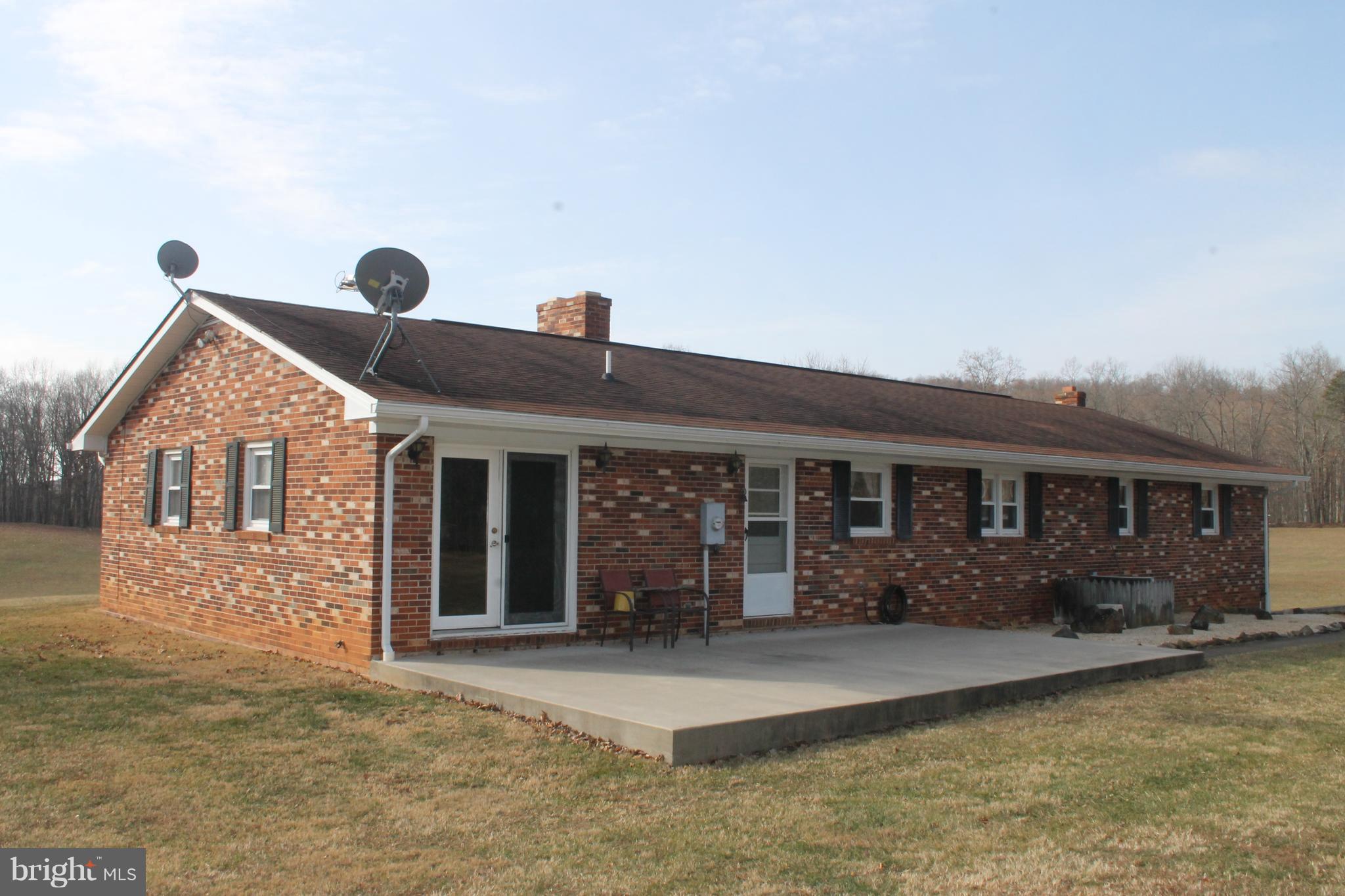 64 Castle Mountain Road Castleton, VA 22716 - Photo 6 of 29 Rear of brick home with patio