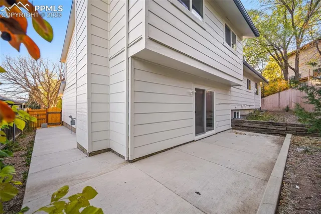 a view of a house with a bed and a yard