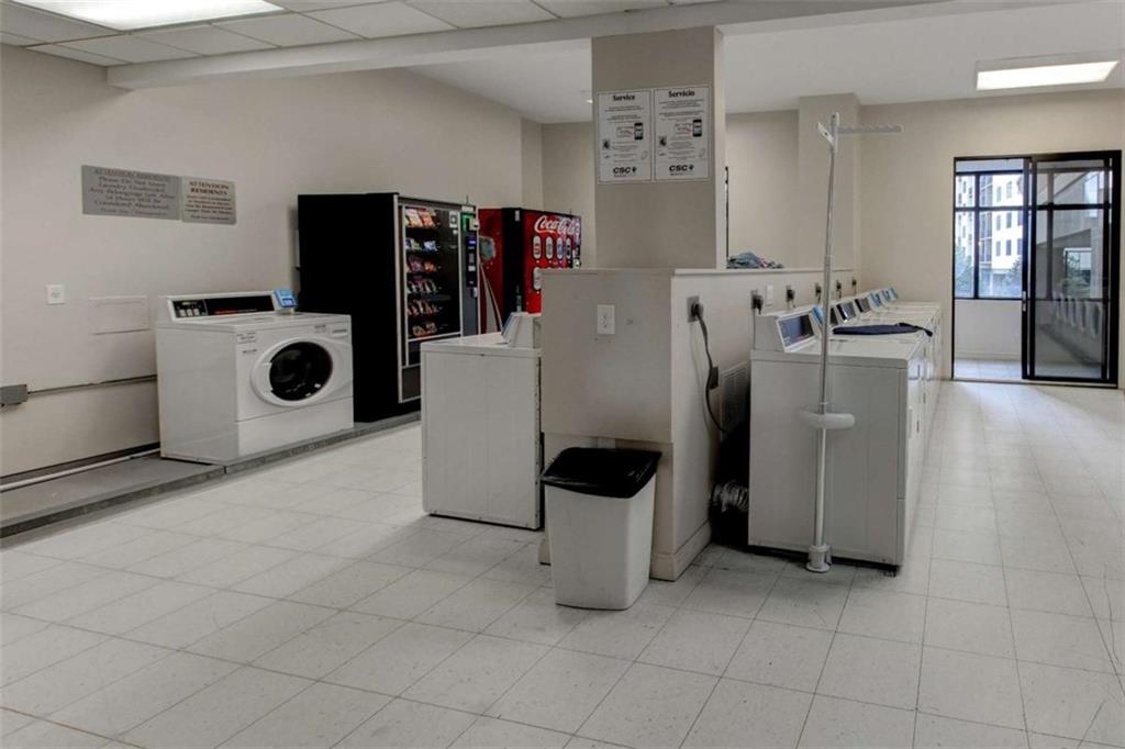 3481 Lakeside Drive Northeast, Unit 902 Atlanta, GA 30326 - Photo 36 of 43 a view of a storage & utility room with washer and dryer