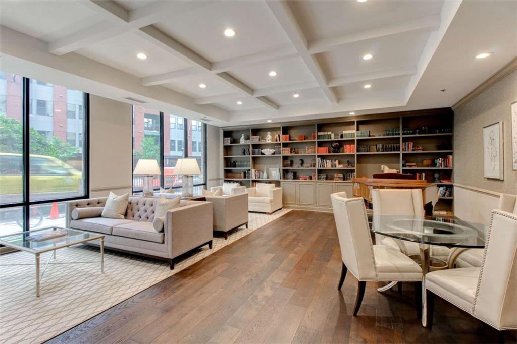 3481 Lakeside Drive Northeast, Unit 902 Atlanta, GA 30326 - Photo 39 of 43 a living room with furniture and a book shelf