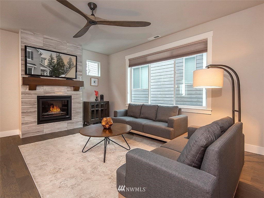 17 197th Place Southwest Bothell, WA 98012 - Photo 12 of 34 a living room with furniture and a fireplace