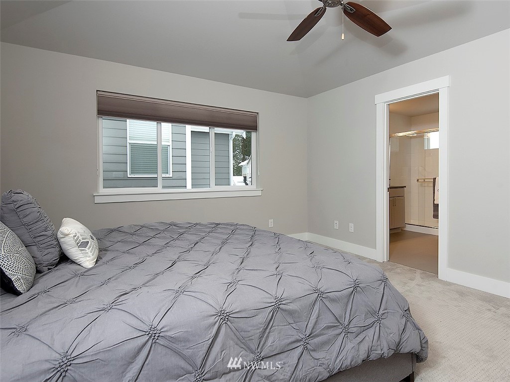 17 197th Place Southwest Bothell, WA 98012 - Photo 22 of 34 a bedroom with a bed and window