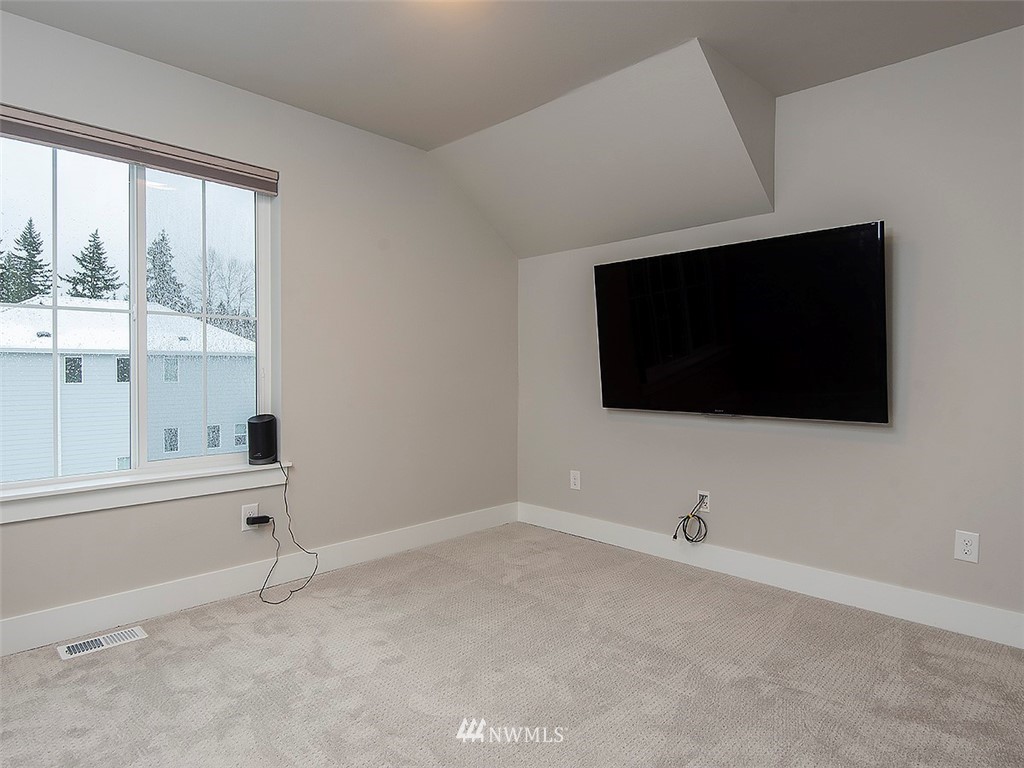 17 197th Place Southwest Bothell, WA 98012 - Photo 31 of 34 a view of a livingroom with a flat screen tv
