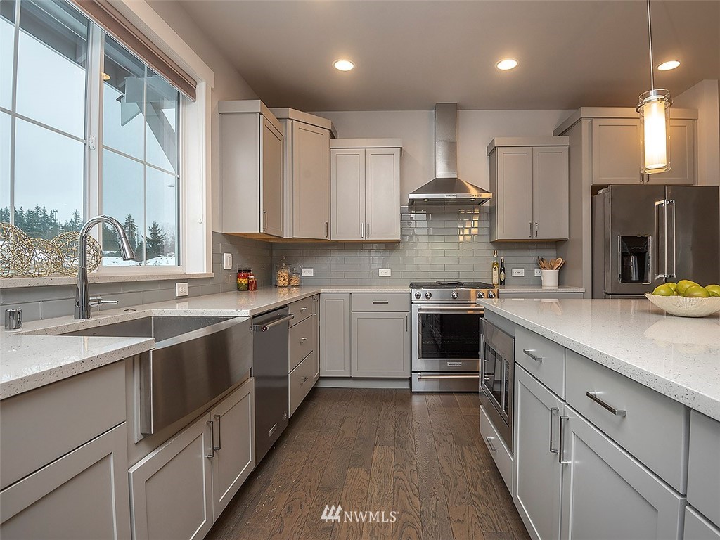 17 197th Place Southwest Bothell, WA 98012 - Photo 6 of 34 a kitchen with a white cabinets and window