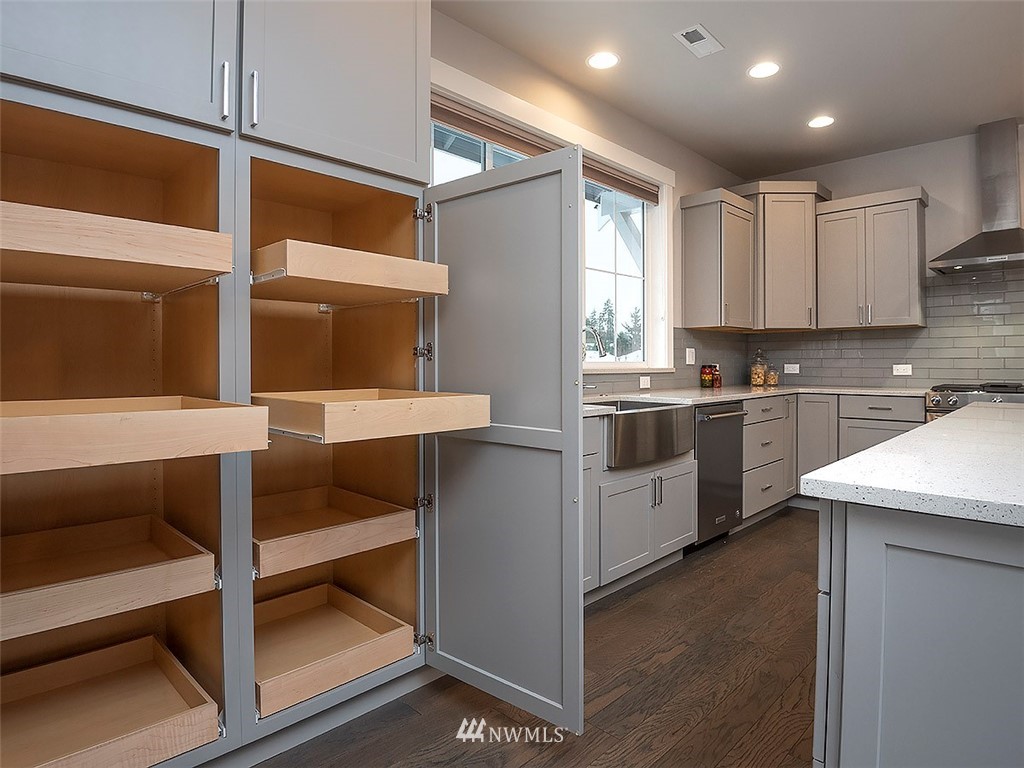 17 197th Place Southwest Bothell, WA 98012 - Photo 9 of 34 a kitchen with a sink cabinets and stainless steel appliances