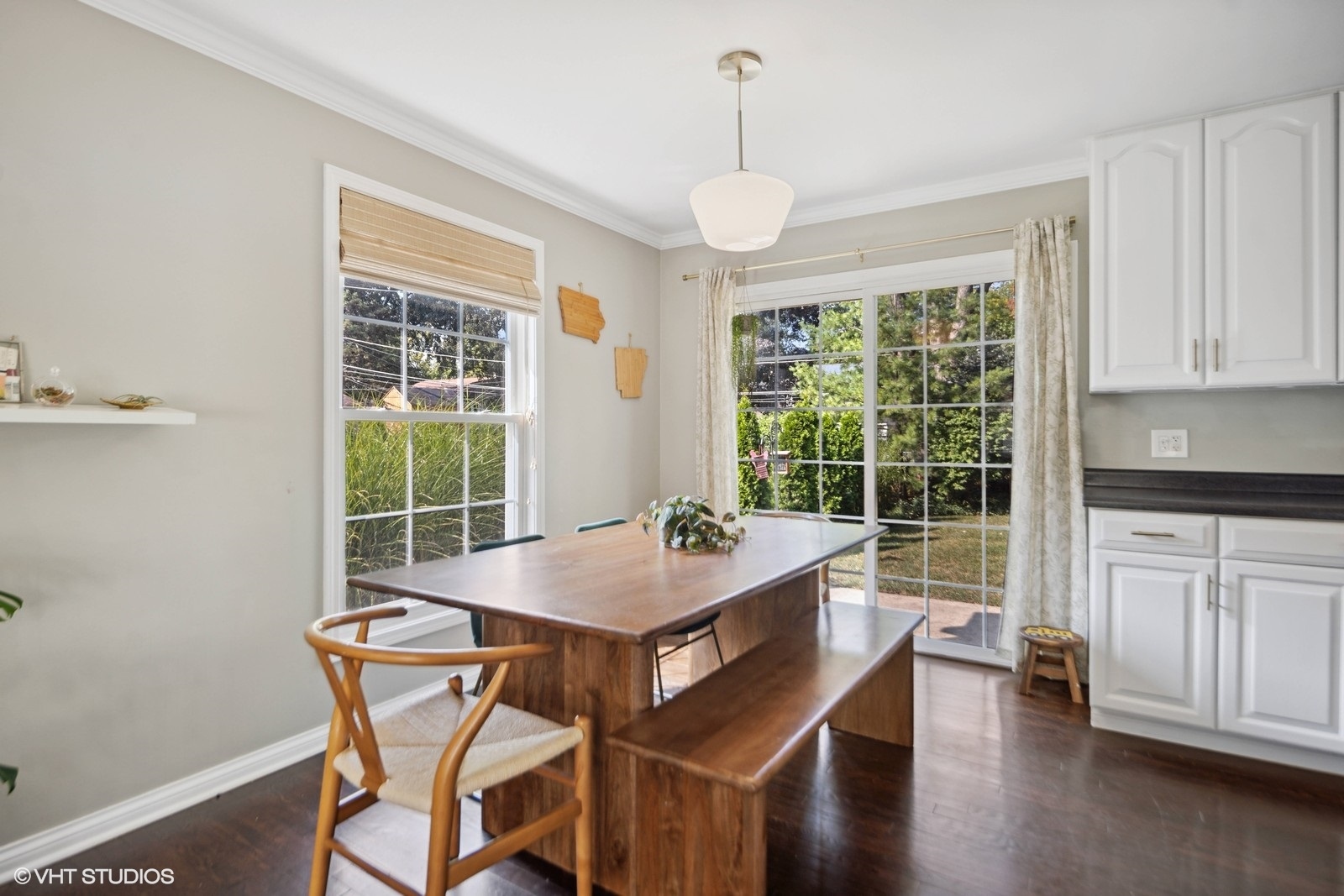 120 North Lambert Road Glen Ellyn, IL 60137 - Photo 11 of 30 a dining room with wooden floor a chandelier a wooden table and chairs