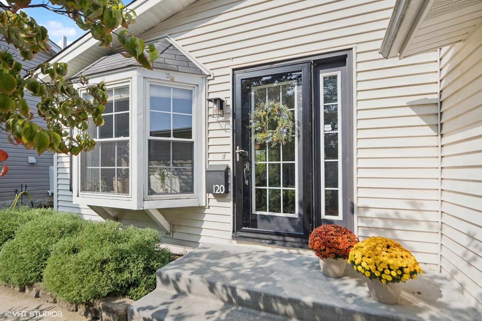 120 North Lambert Road Glen Ellyn, IL 60137 - Photo 3 of 30 a front view of a house with a garden
