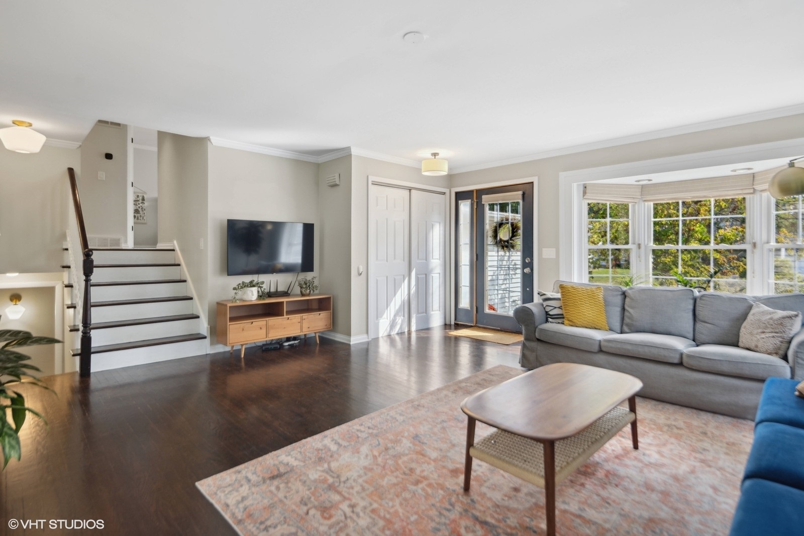 120 North Lambert Road Glen Ellyn, IL 60137 - Photo 5 of 30 a living room with furniture and a flat screen tv with wooden floor