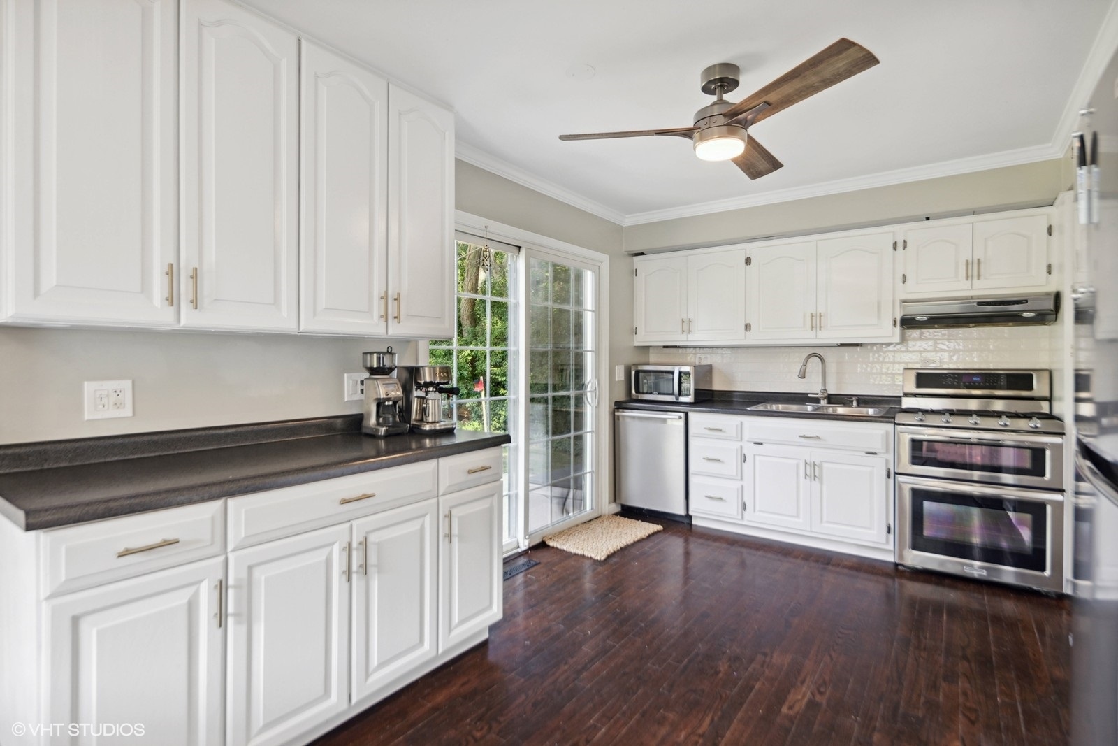120 North Lambert Road Glen Ellyn, IL 60137 - Photo 8 of 30 a kitchen with granite countertop white cabinets and white appliances
