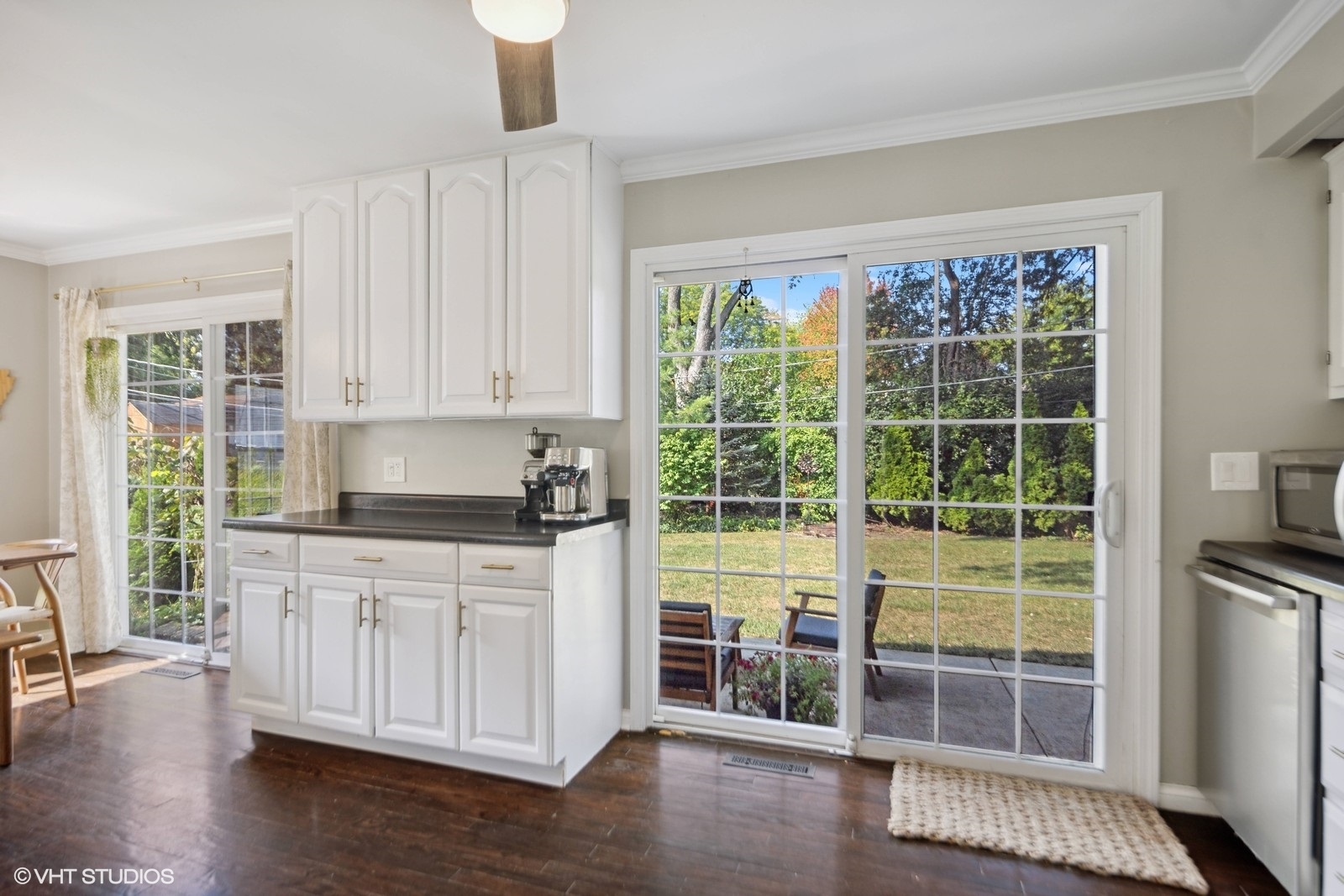120 North Lambert Road Glen Ellyn, IL 60137 - Photo 9 of 30 a kitchen with stainless steel appliances granite countertop a stove a sink and a large window