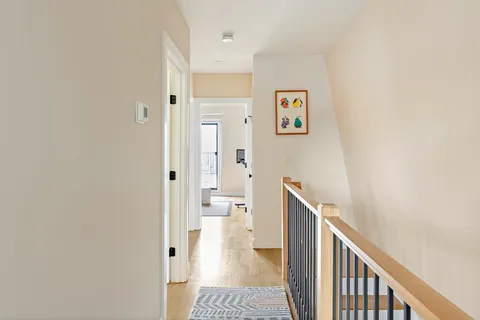 a view of a livingroom with workspace and a window